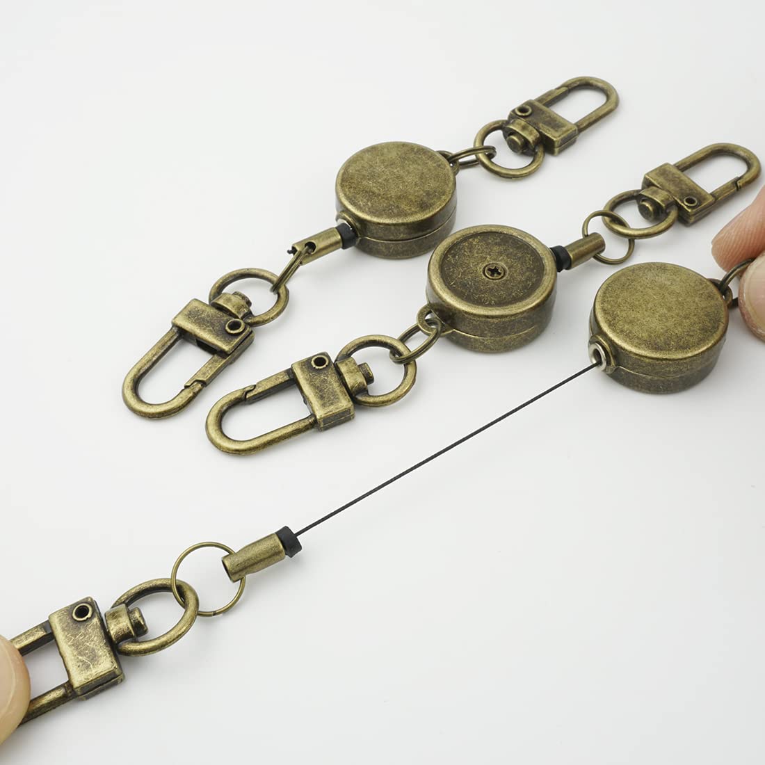 Amazon.co.jp: 伸びる リール ナスカン付き リールキー キーホルダー